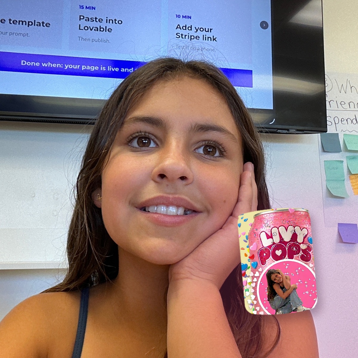 Livy Pops creator Olivia Mehran holding her pink soda can